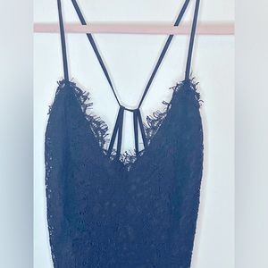 Express spaghetti strap plunge(not deep) neck lace peplum black top.  Size M